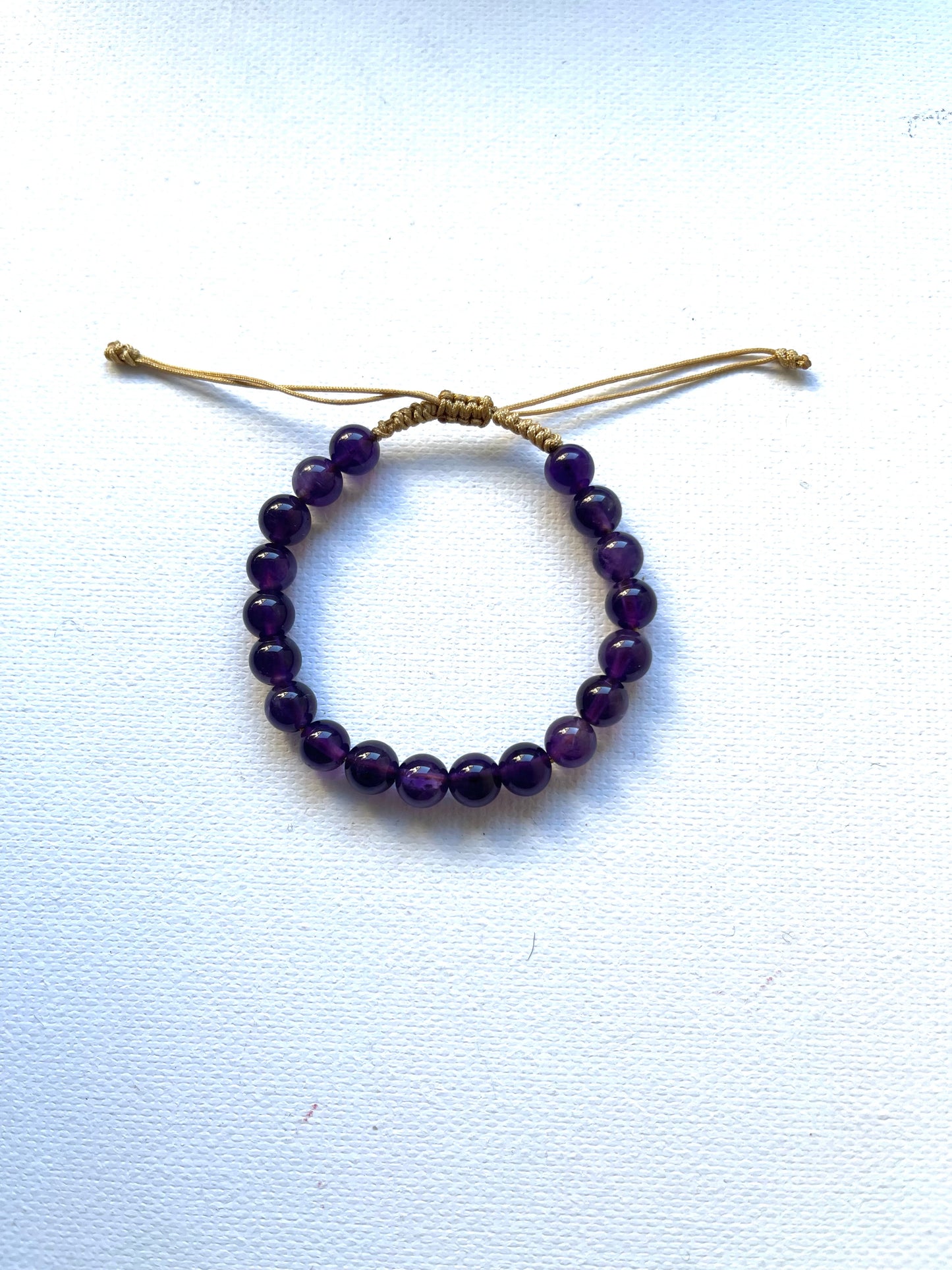 Pulsera amatista 6-7mm con hilo ajustable